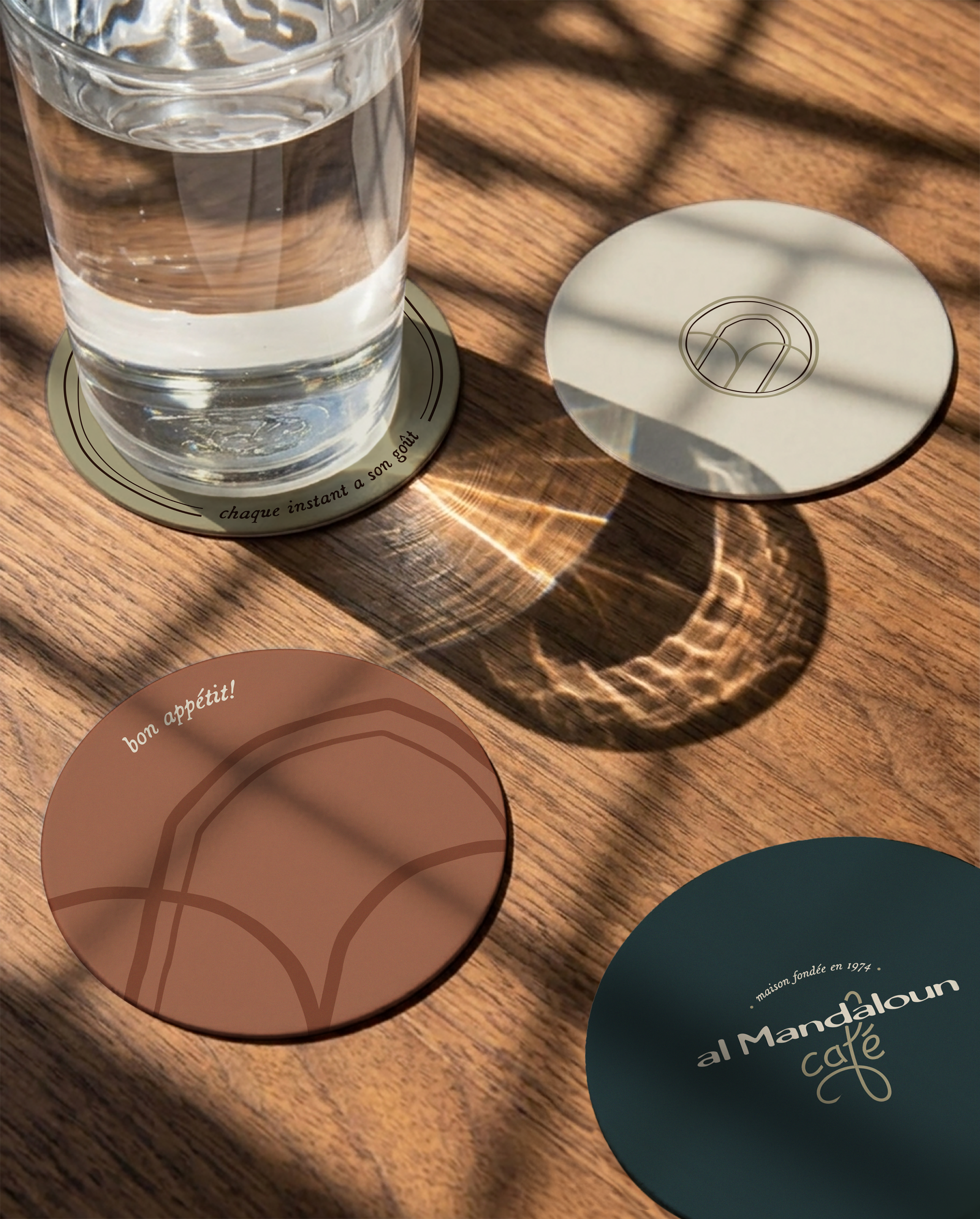 A render of three white cylindrical columns, against a warm creme background
